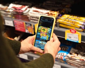 Customer using Scan & Save instore