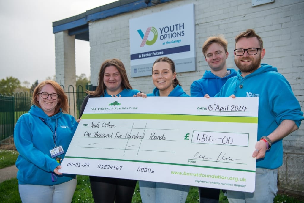 The team at Youth Options with the cheque for £1,500 from David Wilson Homes